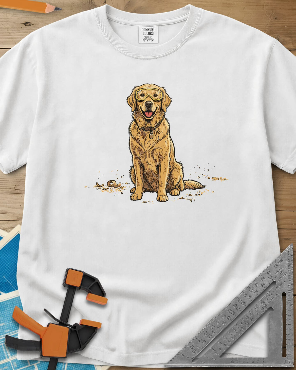 Shop Dog Safety First heavyweight tee in White, a golden retriever in safety goggles sitting in wood shavings