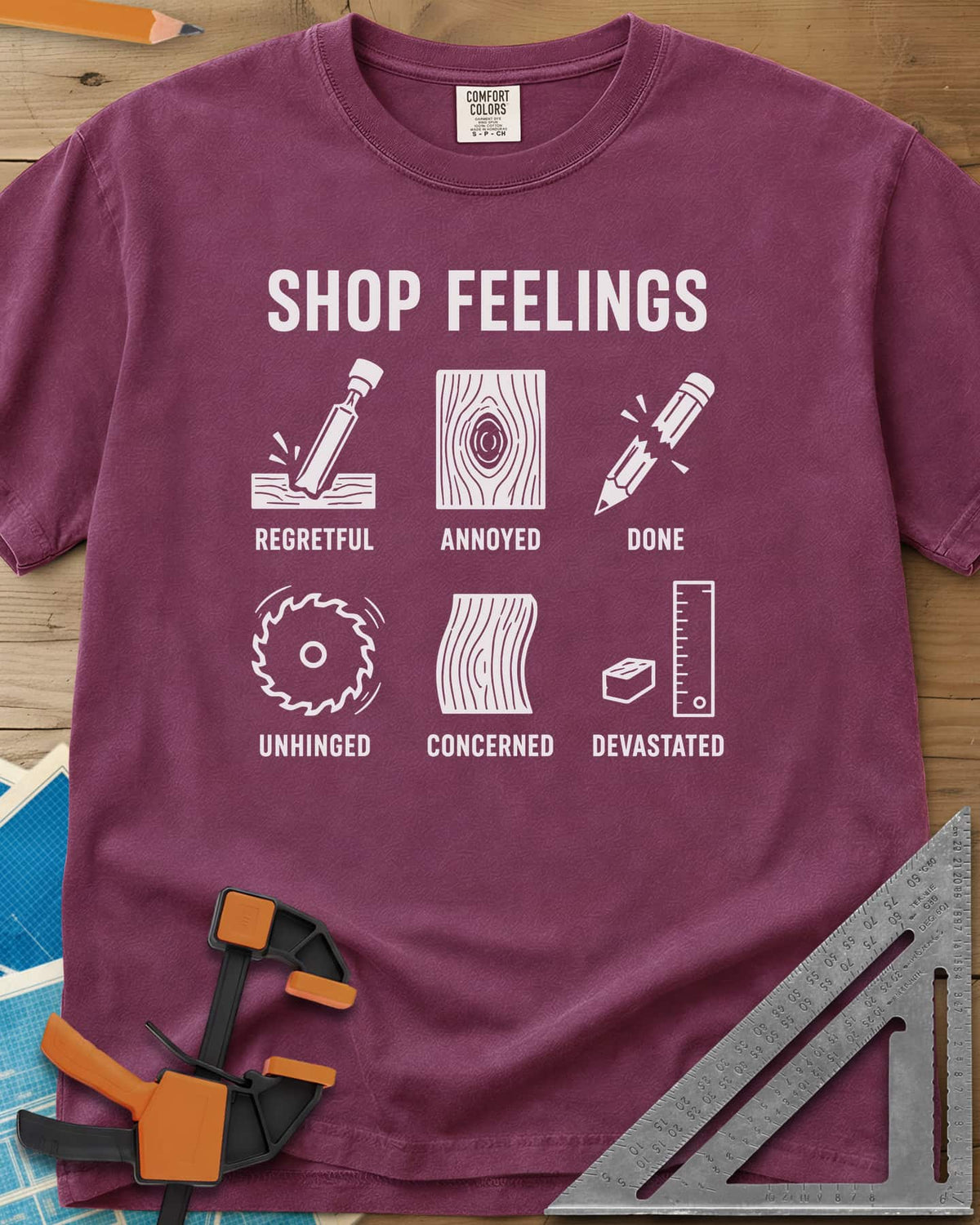 Shop Feelings heavyweight tee in Berry, six small icons from a chisel to a snapped pencil, each labeled