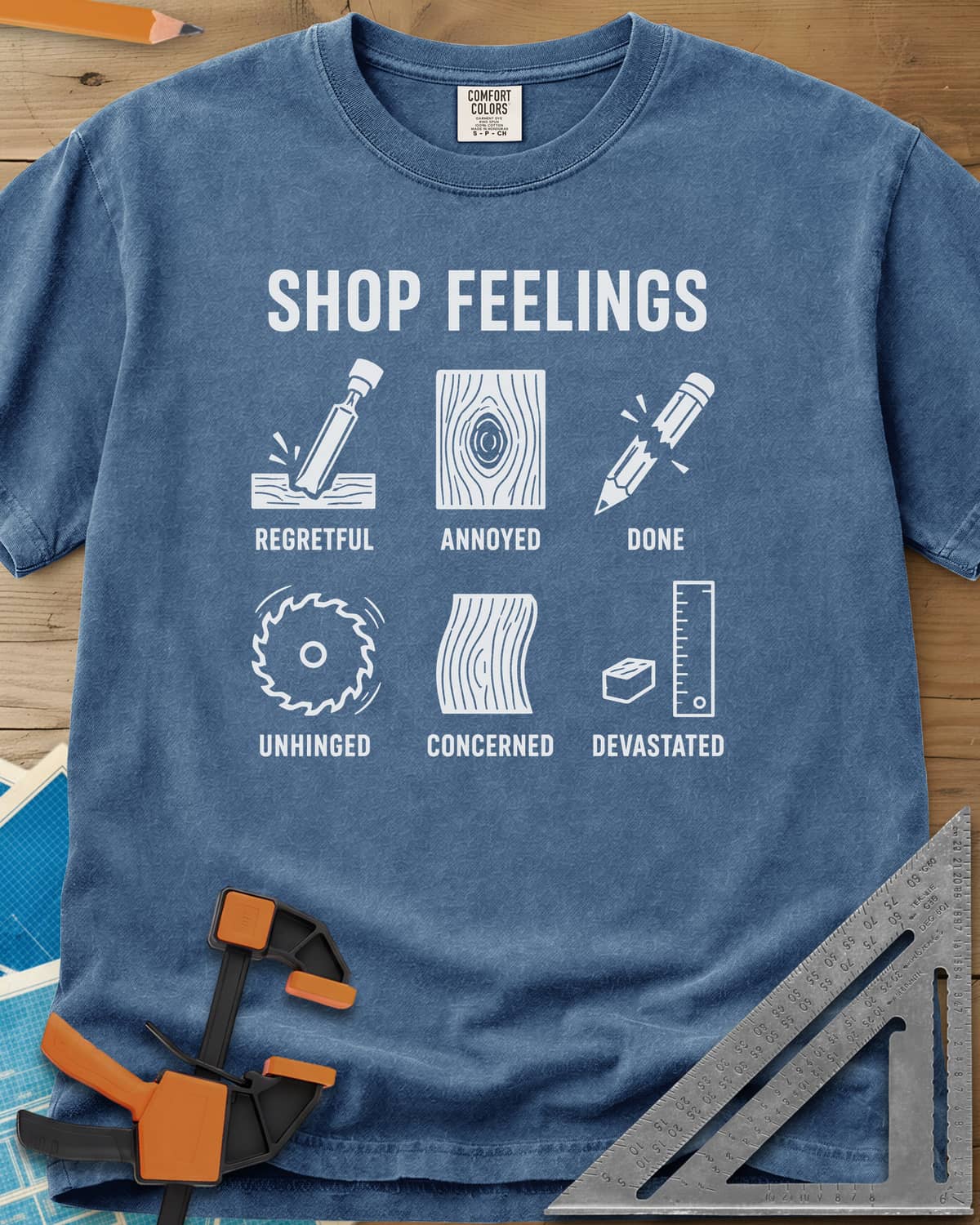 Shop Feelings heavyweight tee in Blue Jean, six small icons from a chisel to a snapped pencil, each labeled