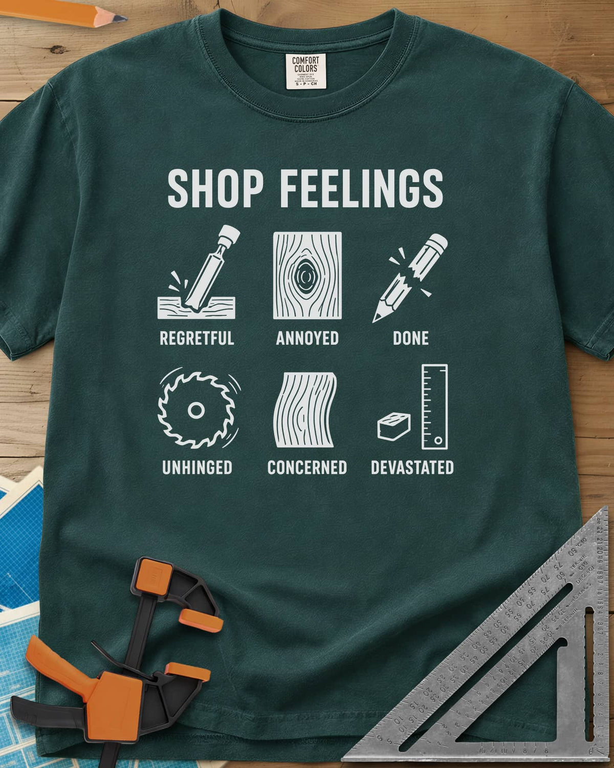 Shop Feelings heavyweight tee in Blue Spruce, six small icons from a chisel to a snapped pencil, each labeled