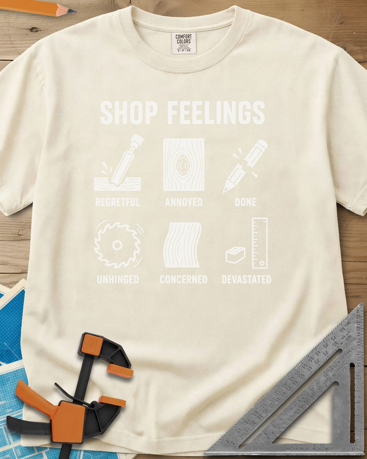 Shop Feelings heavyweight tee in Ivory, six small icons from a chisel to a snapped pencil, each labeled