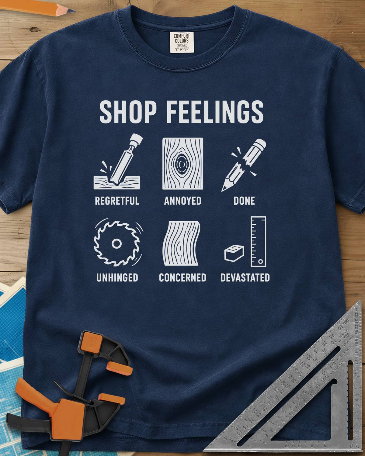 Shop Feelings heavyweight tee in Navy, six small icons from a chisel to a snapped pencil, each labeled