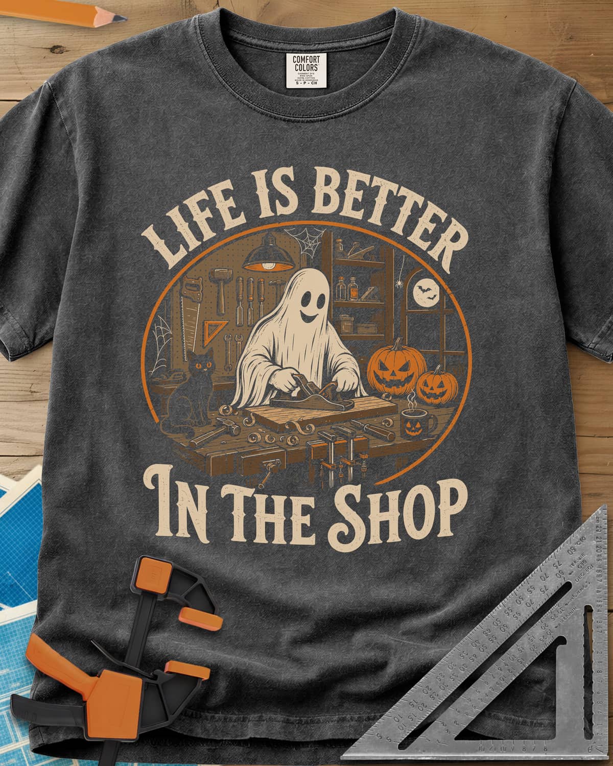 Shop Life heavyweight tee in Pepper, a smiling ghost planing a board beside a cat and pumpkins