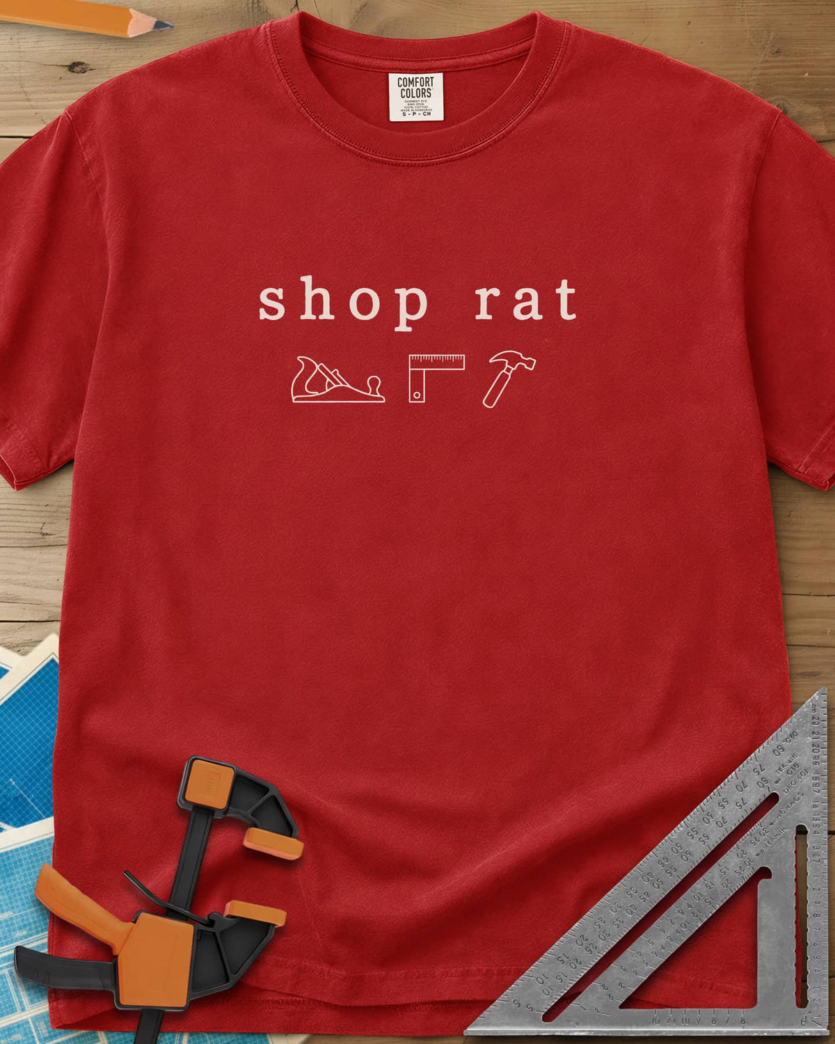 Shop Rat heavyweight tee in Red, a hand plane, a square and a hammer in thin outline