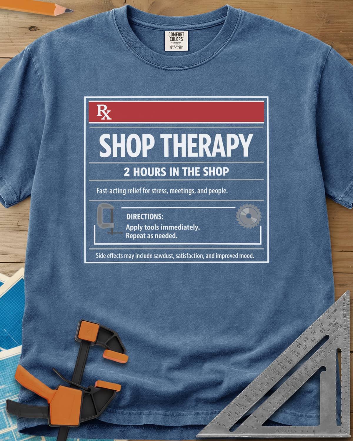 Shop Therapy heavyweight tee in Blue Jean, mock prescription label with clamp and saw blade icons