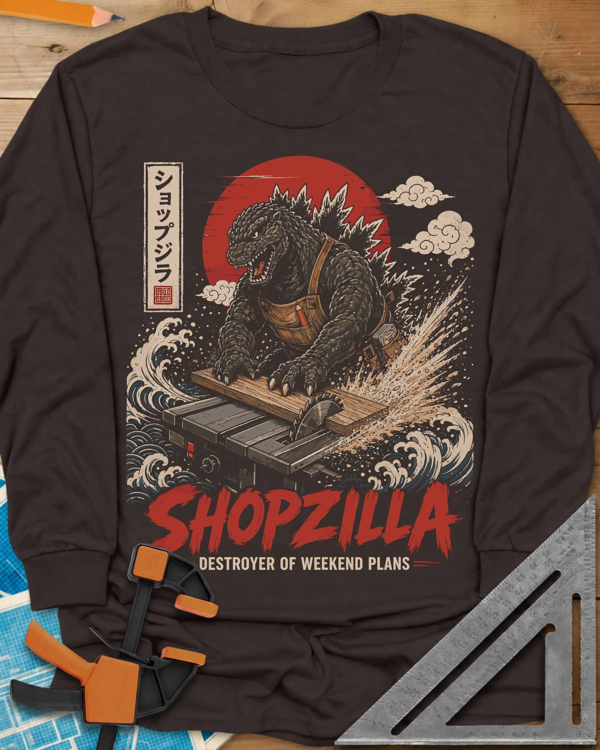 Shopzilla long sleeve shirt in Dark Chocolate, a monster in a tool apron pushing a board through a table saw