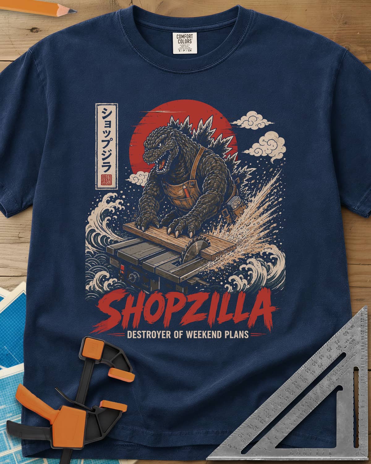 Shopzilla heavyweight tee in Navy, a monster in a tool apron pushing a board through a table saw