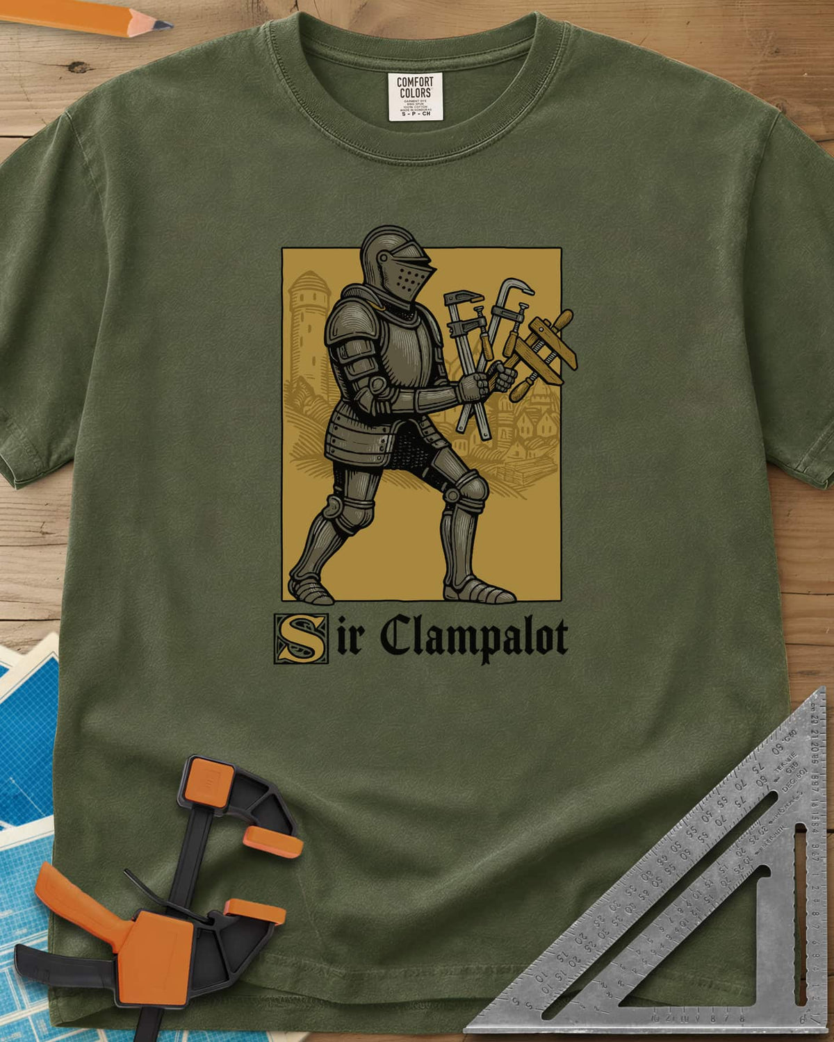 Sir Clampalot heavyweight tee in Hemp, an armored knight carrying an armful of clamps