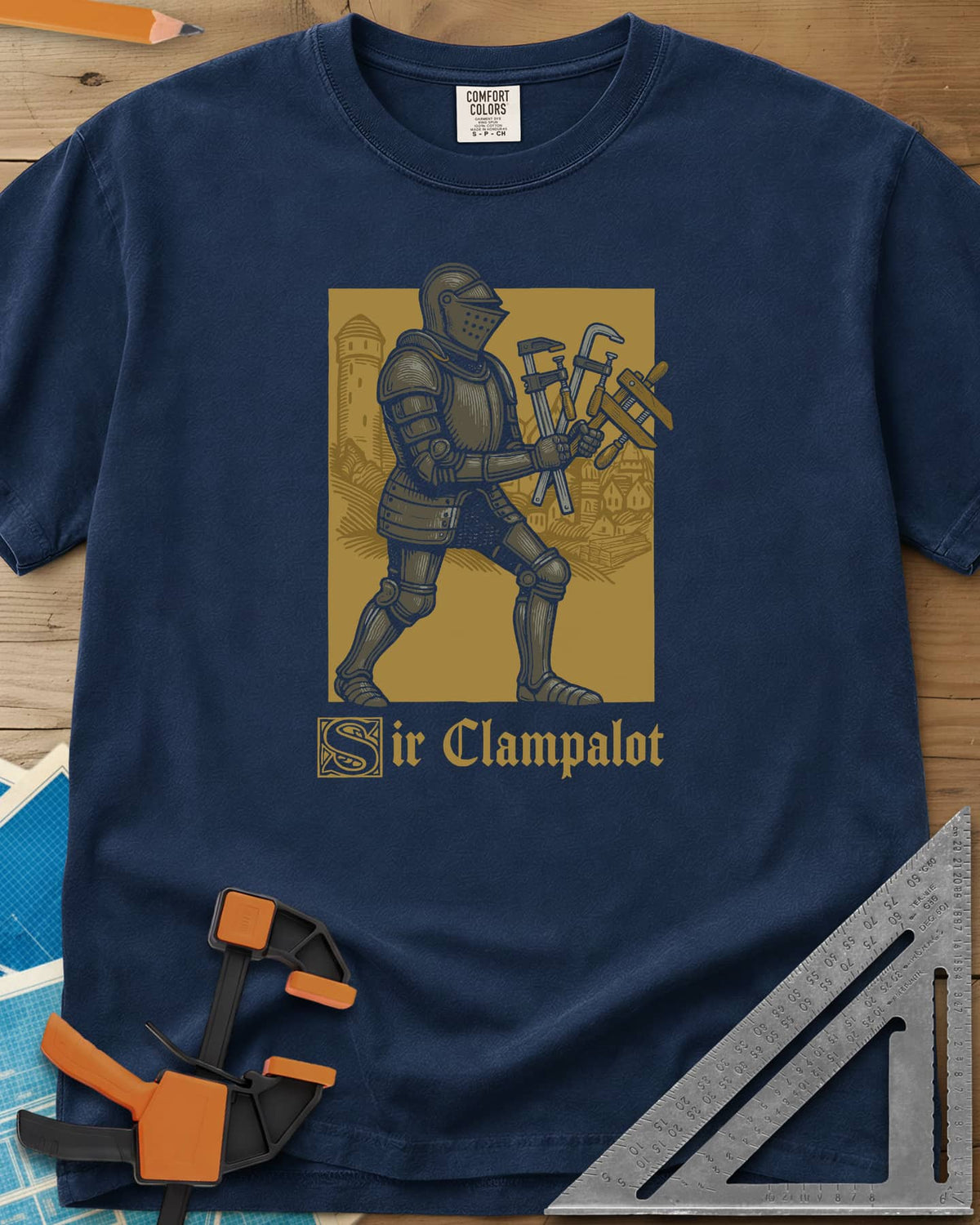 Sir Clampalot heavyweight tee in Navy, an armored knight carrying an armful of clamps