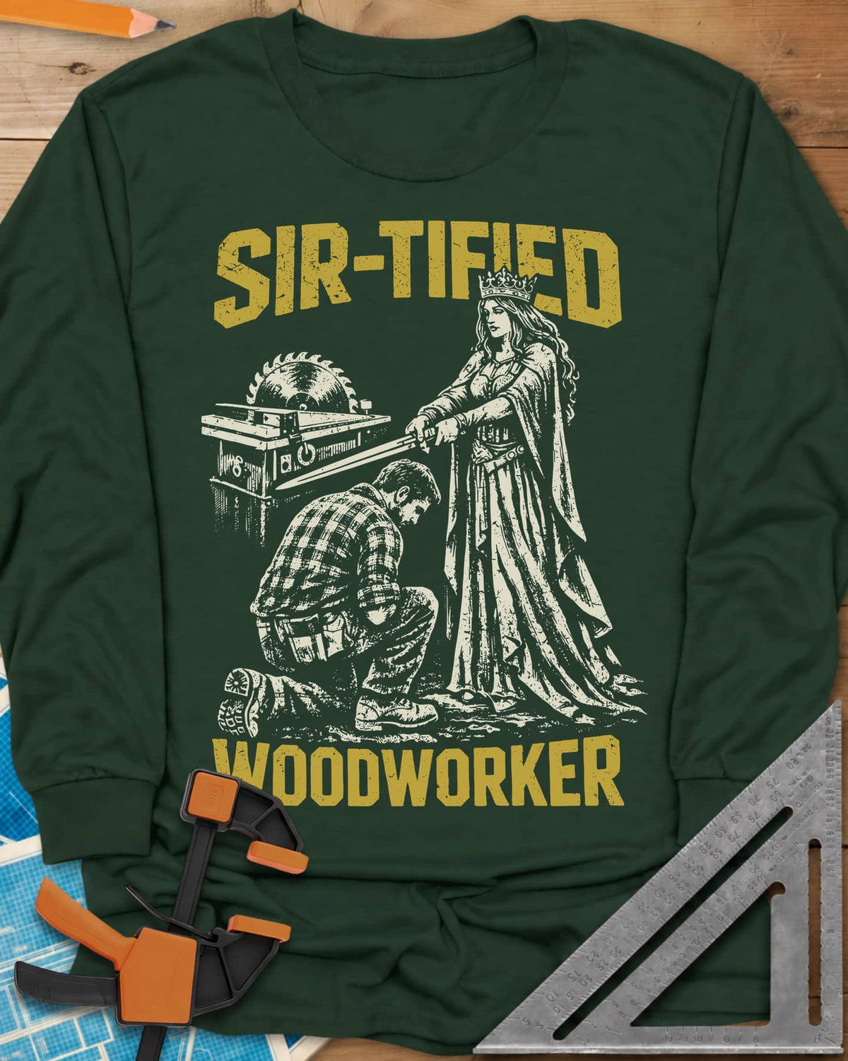 Sir Tified Woodworker long sleeve shirt in Forest Green, a queen knighting a kneeling woodworker beside a table saw