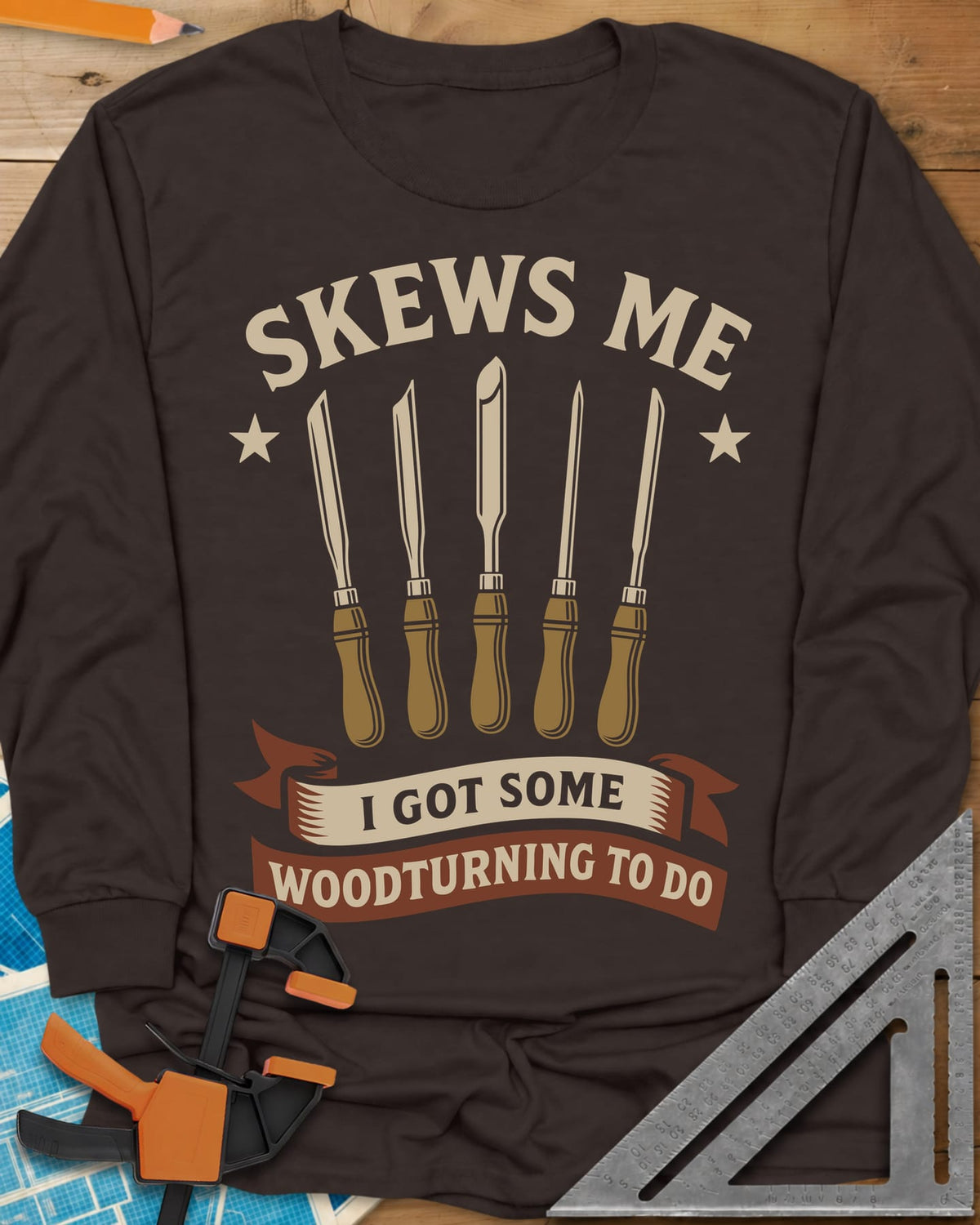 Skews Me long sleeve shirt in Dark Chocolate, five turning tools between two stars above a ribbon banner