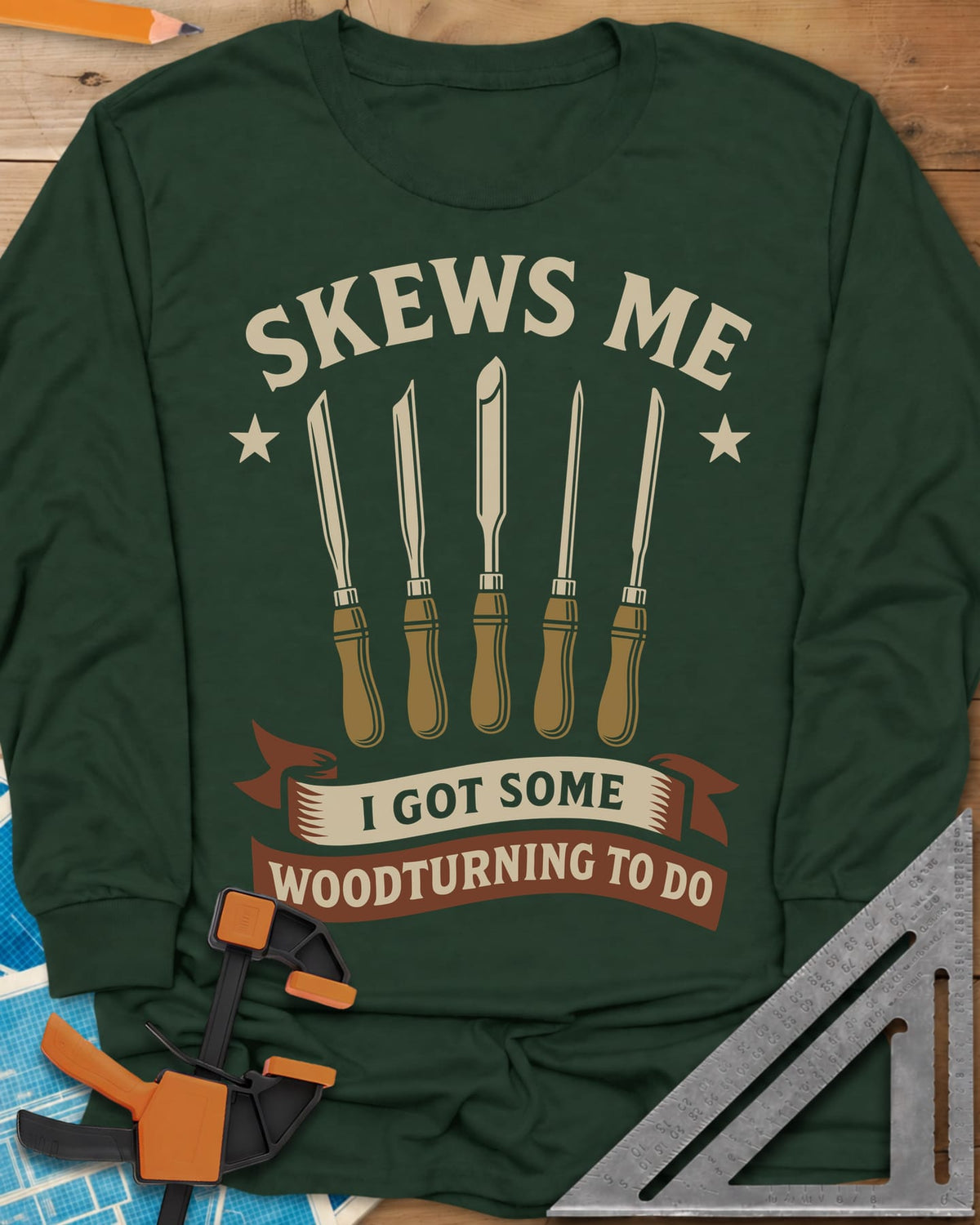 Skews Me long sleeve shirt in Forest Green, five turning tools between two stars above a ribbon banner