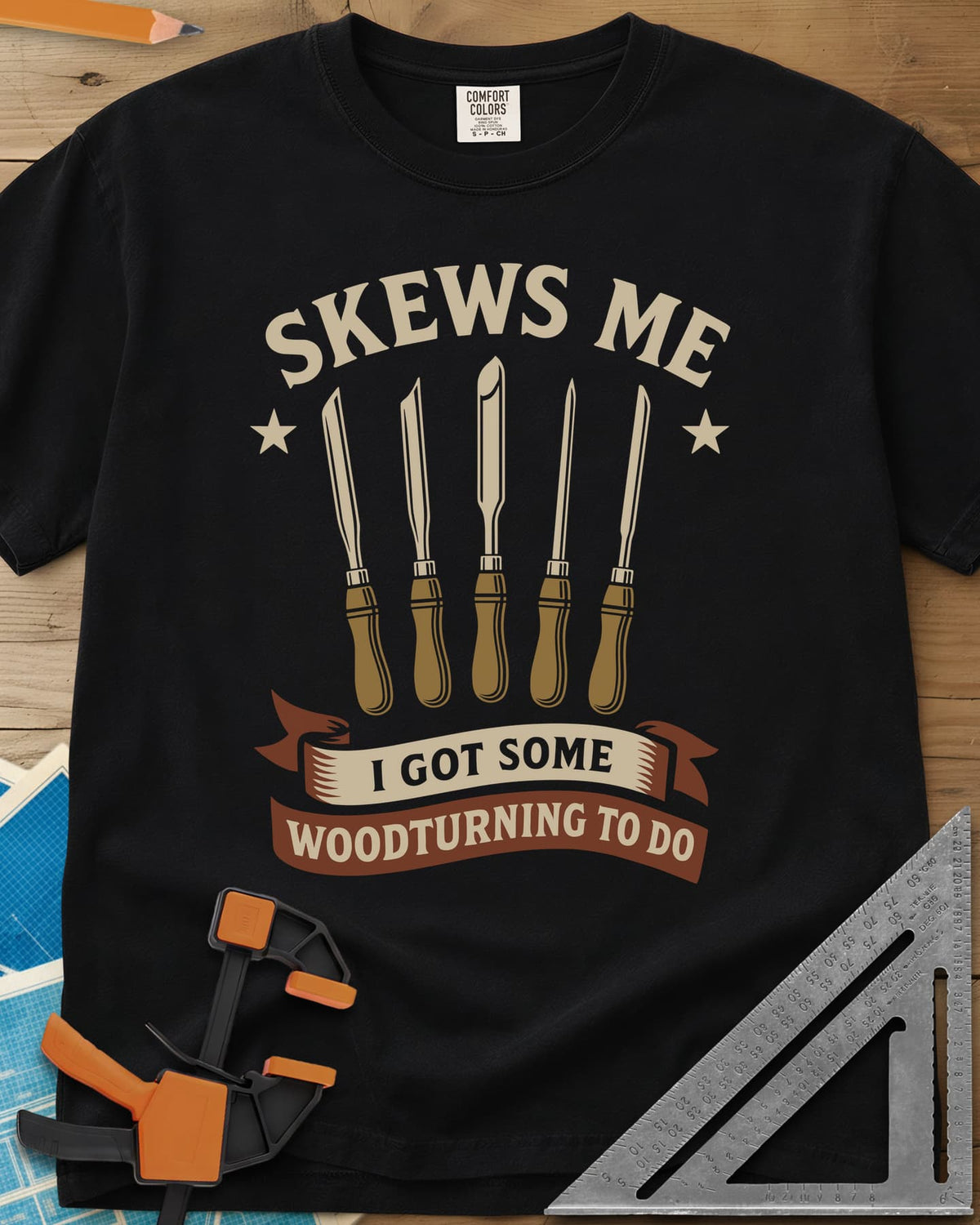 Skews Me heavyweight tee in Black, five turning tools between two stars above a ribbon banner