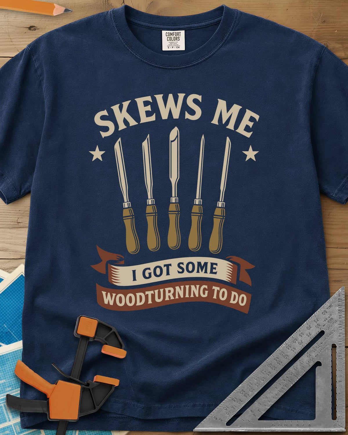 Skews Me heavyweight tee in Navy, five turning tools between two stars above a ribbon banner