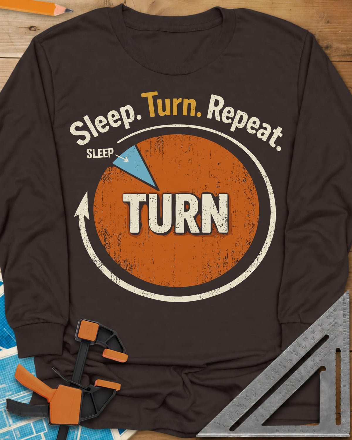 Sleep Turn Repeat long sleeve shirt in Dark Chocolate, a pie chart that is almost all TURN with a sliver of SLEEP