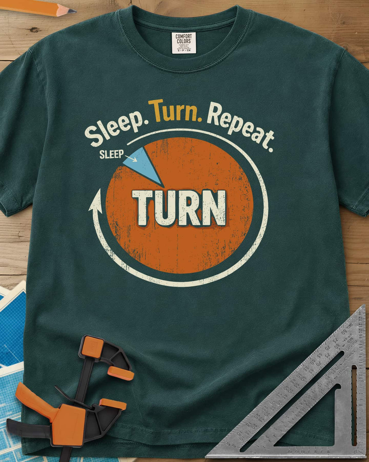 Sleep Turn Repeat heavyweight tee in Blue Spruce, a pie chart that is almost all TURN with a sliver of SLEEP