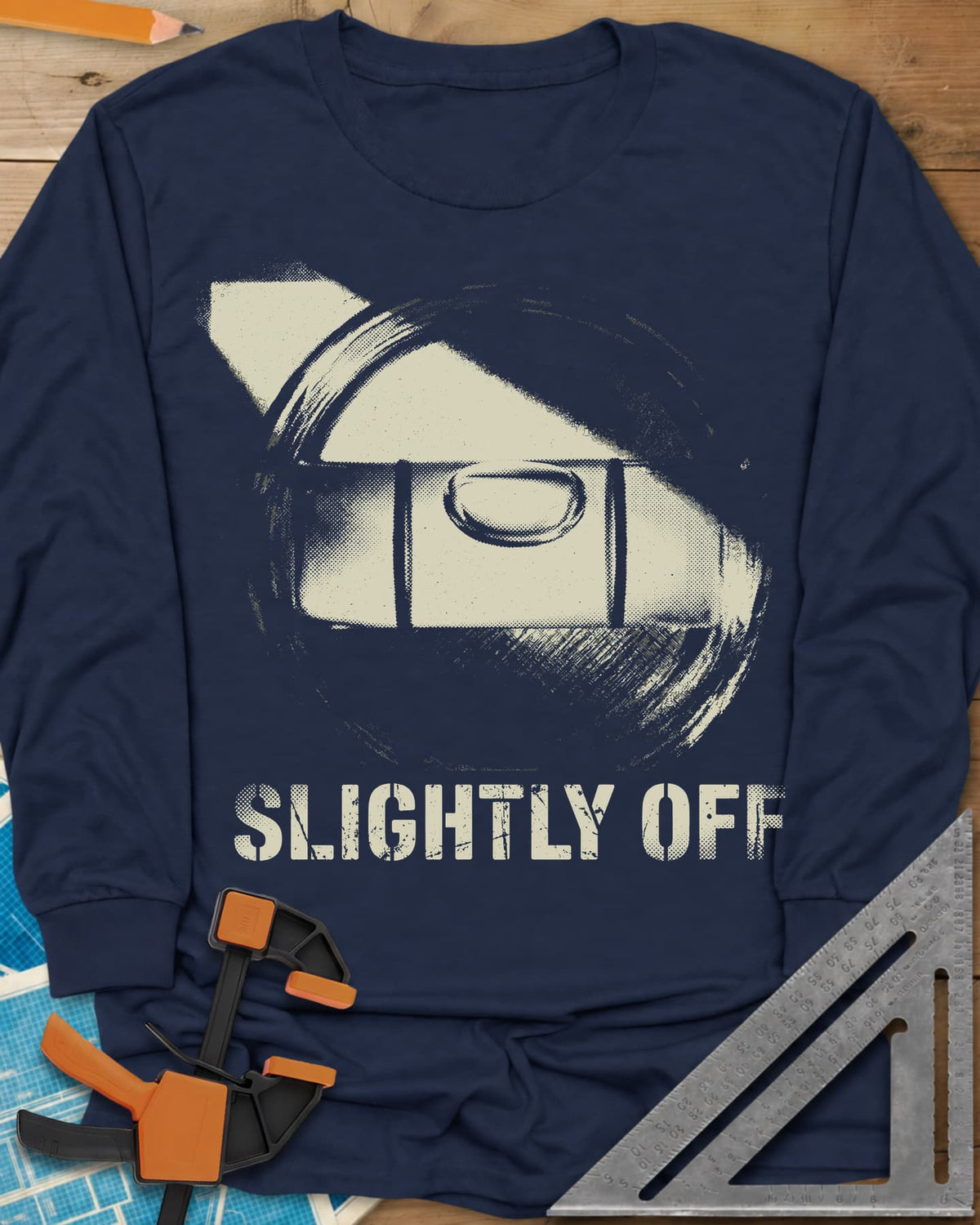 Slightly Off Level long sleeve shirt in Navy, a tilted spirit level and its bubble vial in grainy halftone
