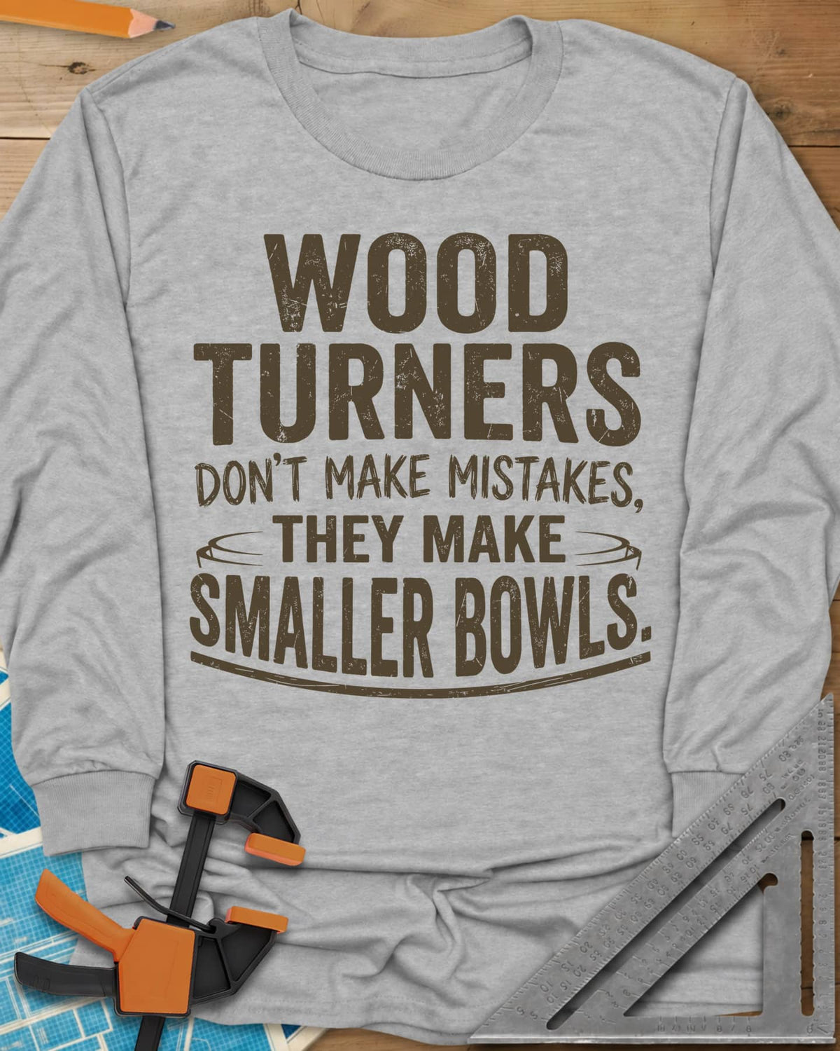 Smaller Bowls long sleeve shirt in Sport Grey, a simple bowl outline curving around the last lines of text