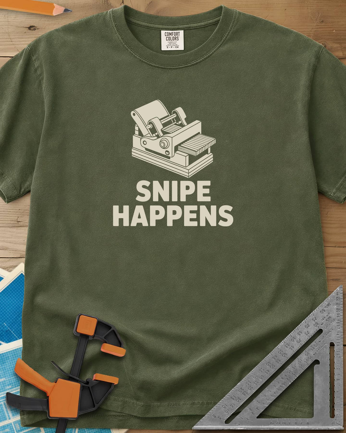Snipe Happens heavyweight tee in Hemp, a thickness planer line drawing with boards at the outfeed