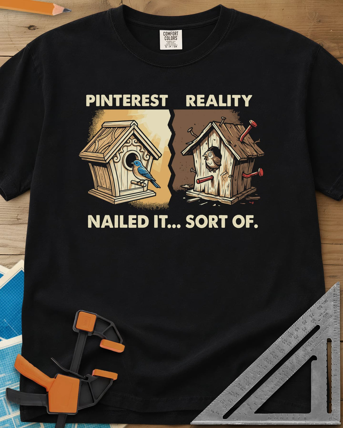 Sort Of Nailed heavyweight tee in Black, a neat birdhouse beside a crooked one bristling with bent nails