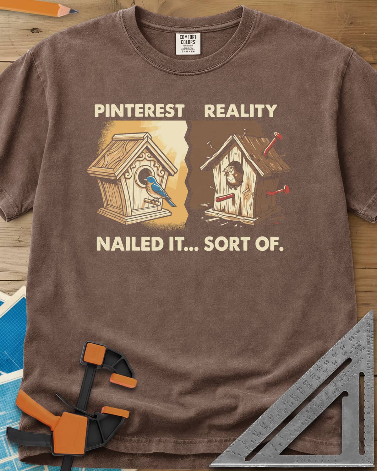 Sort Of Nailed heavyweight tee in Espresso, a neat birdhouse beside a crooked one bristling with bent nails