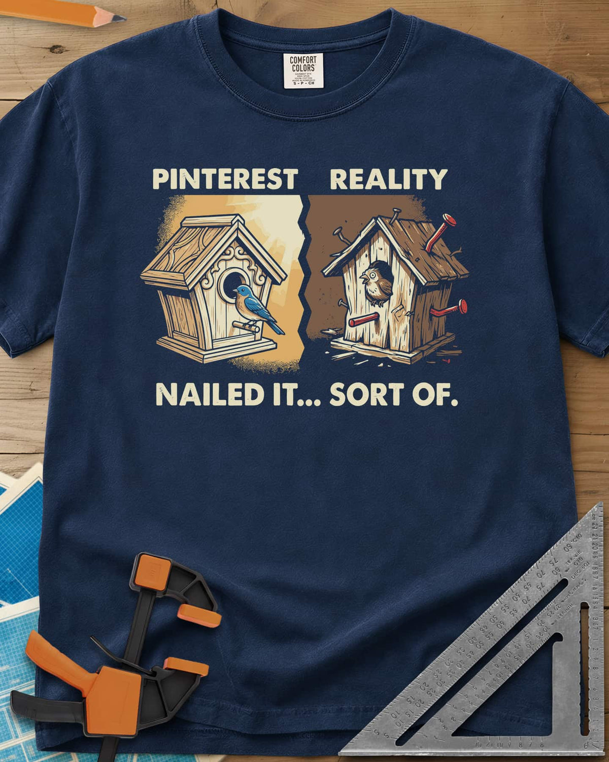 Sort Of Nailed heavyweight tee in Navy, a neat birdhouse beside a crooked one bristling with bent nails