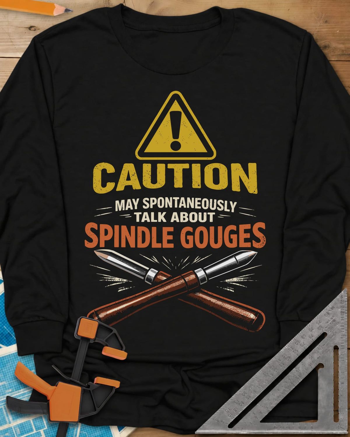 Spindle Gouges long sleeve shirt in Black, a hazard triangle above two crossed spindle gouges