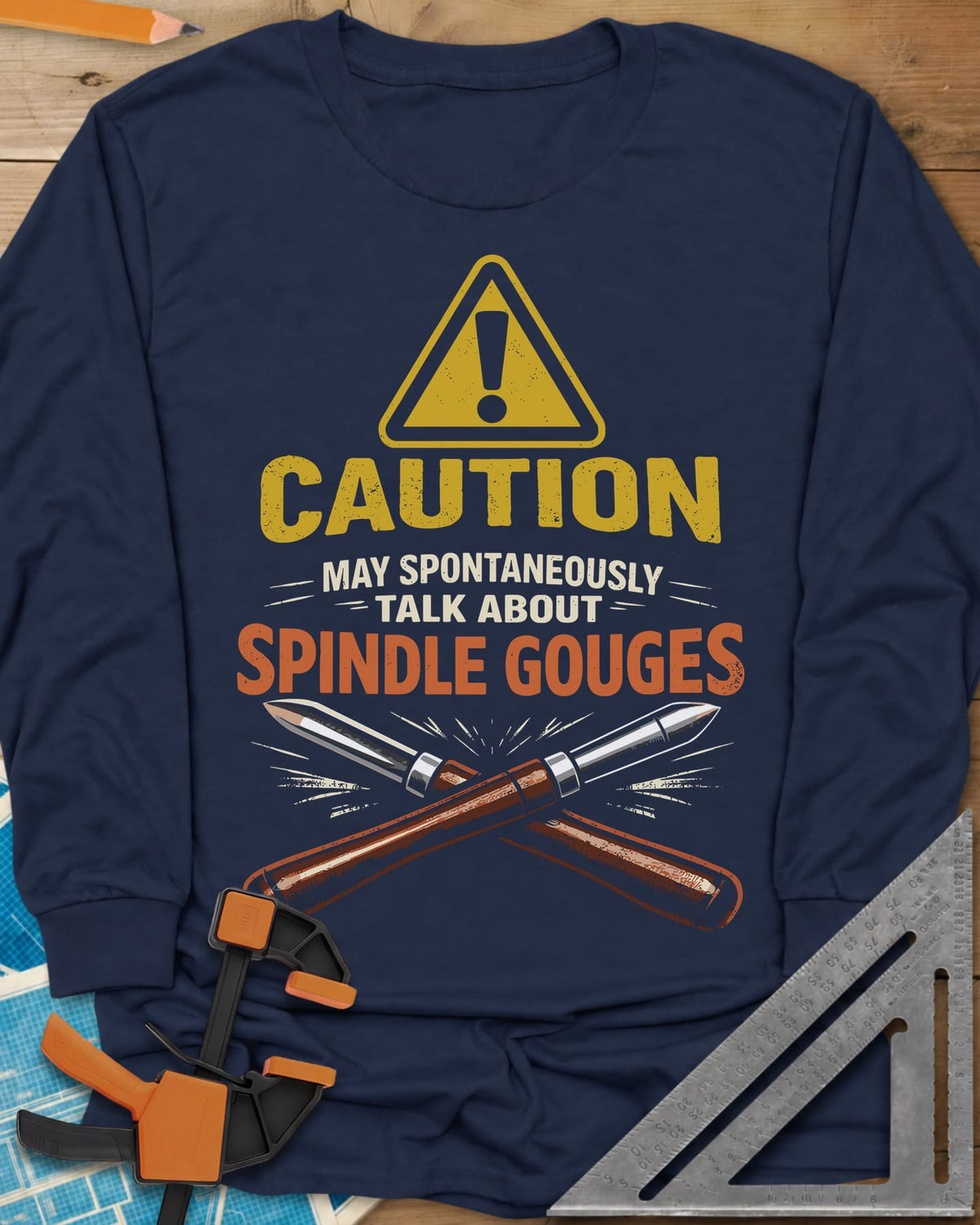 Spindle Gouges long sleeve shirt in Navy, a hazard triangle above two crossed spindle gouges