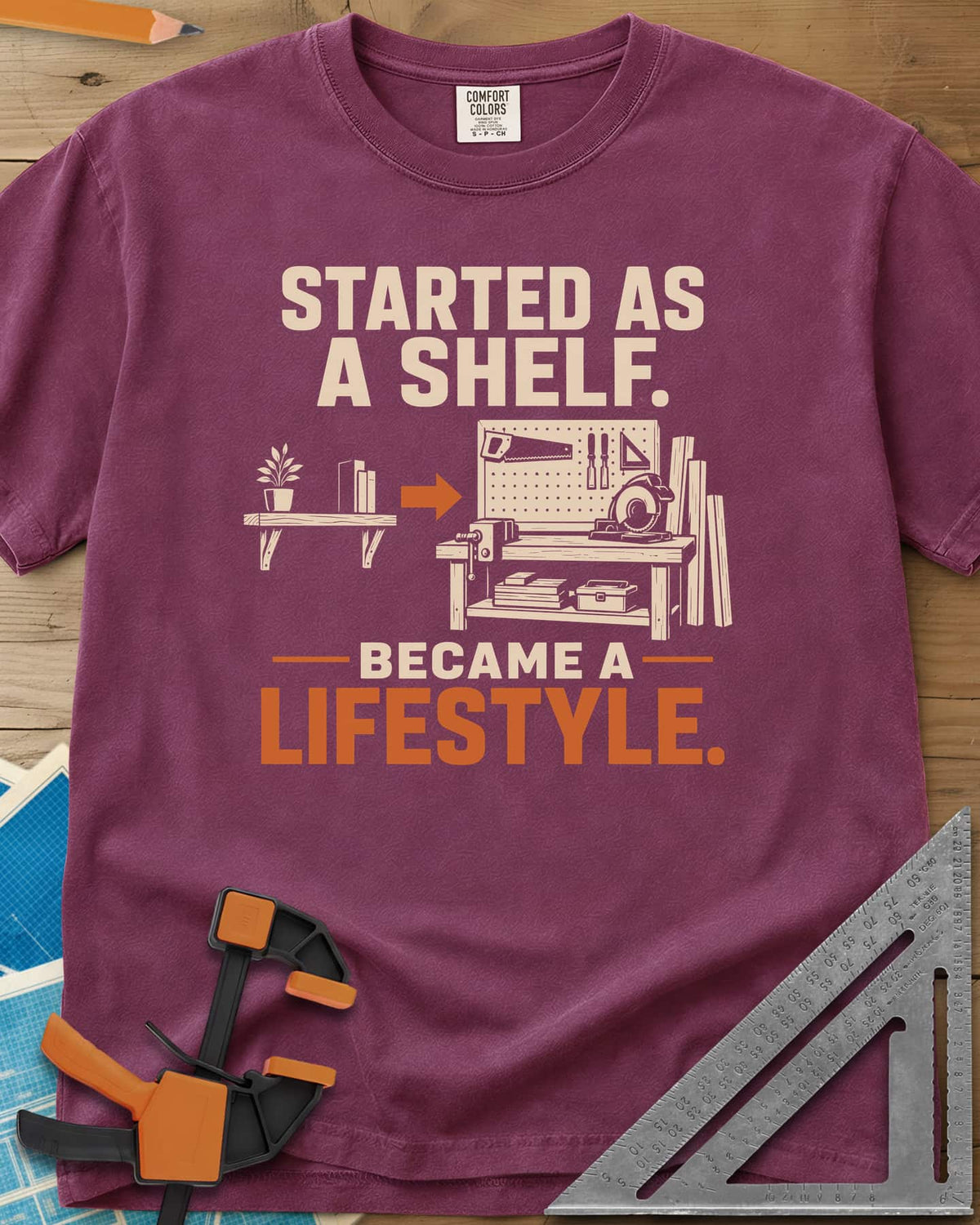 Started As A Shelf heavyweight tee in Berry, a plant shelf, an arrow, then a workbench with pegboard and vise