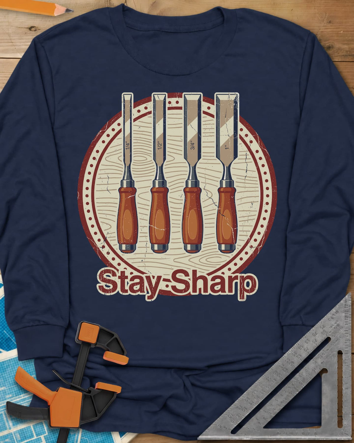 Stay Sharp long sleeve shirt in Navy, four wood chisels on a round wood-grain badge
