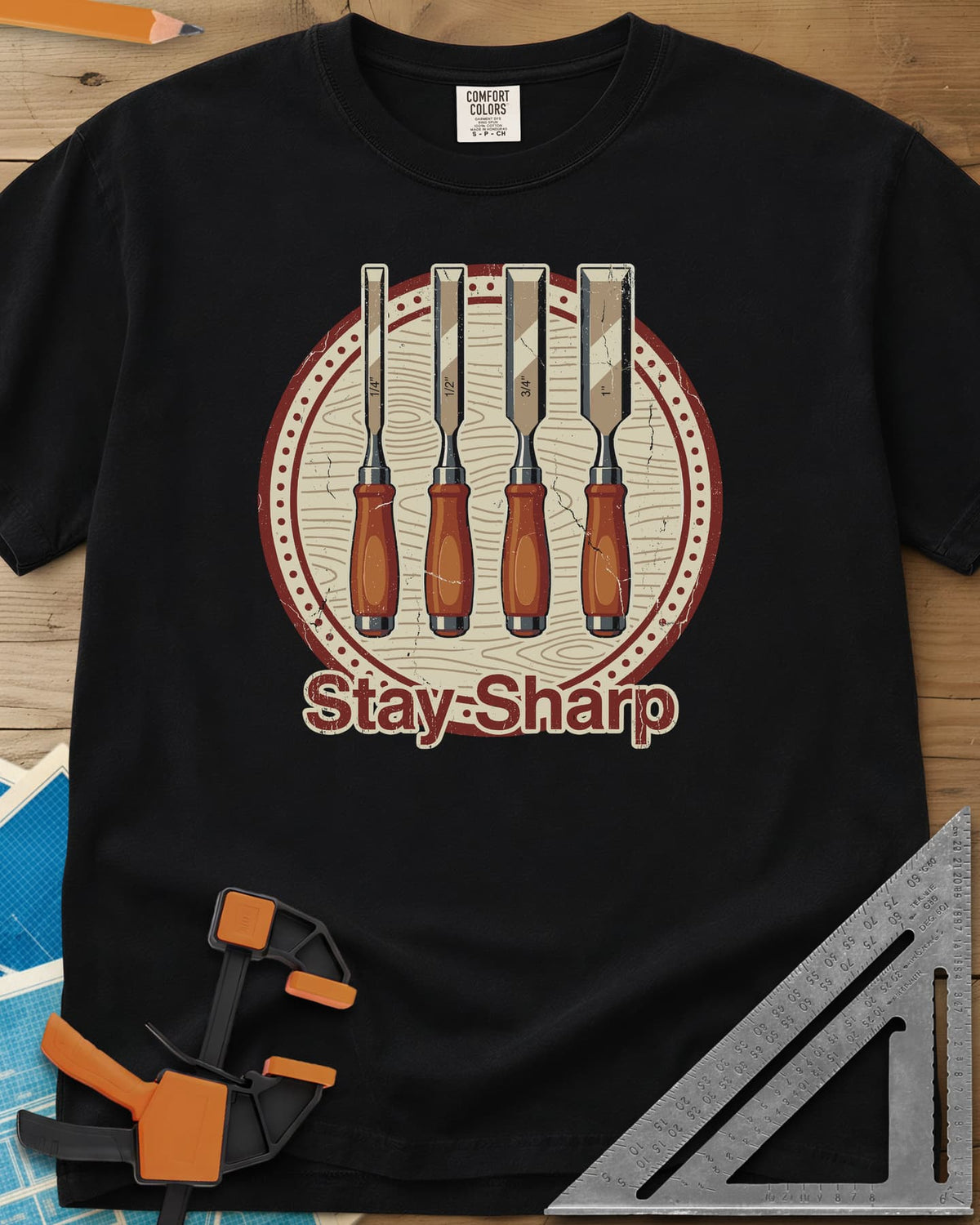Stay Sharp heavyweight tee in Black, four wood chisels on a round wood-grain badge