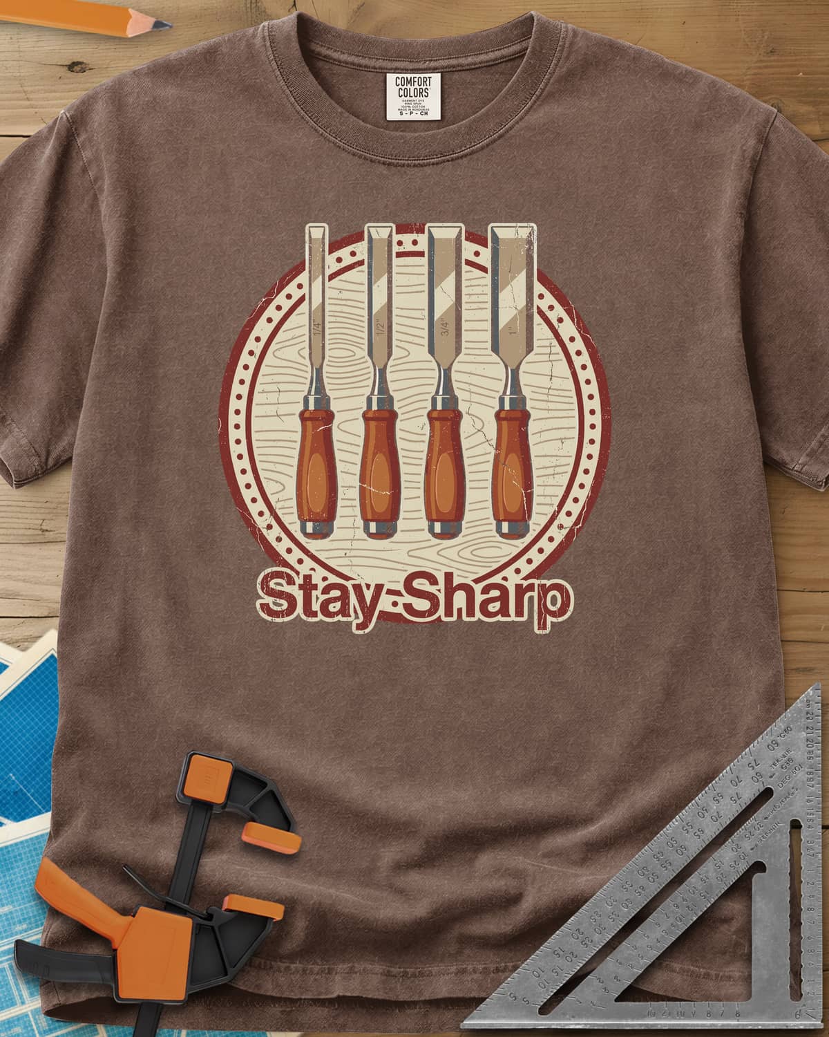 Stay Sharp heavyweight tee in Espresso, four wood chisels on a round wood-grain badge