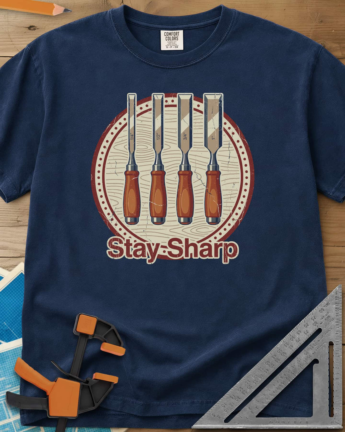 Stay Sharp heavyweight tee in Navy, four wood chisels on a round wood-grain badge