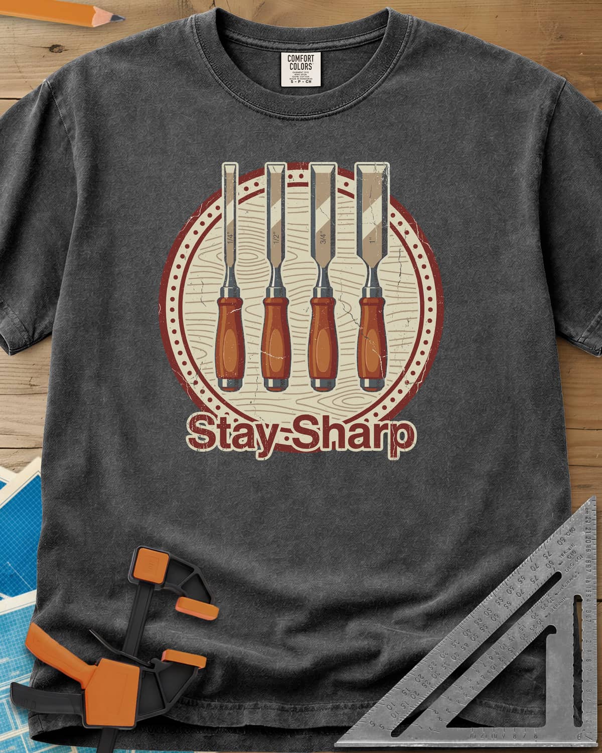 Stay Sharp heavyweight tee in Pepper, four wood chisels on a round wood-grain badge