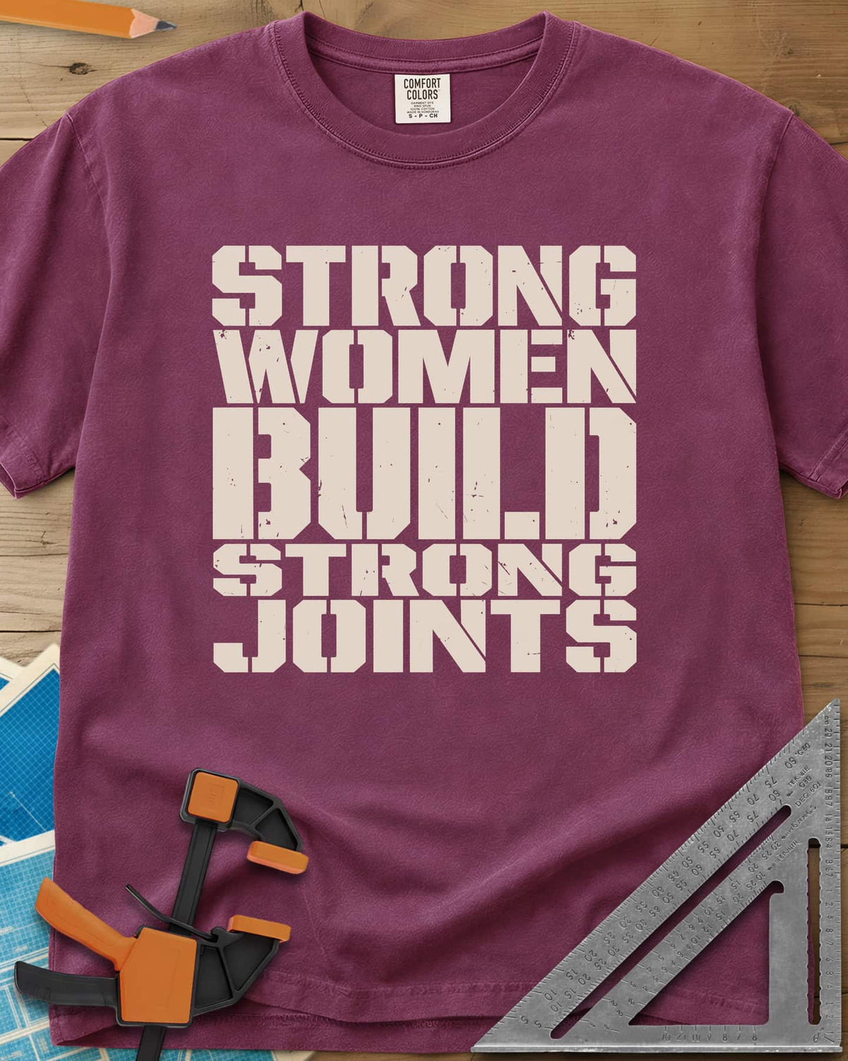 Strong Women heavyweight tee in Berry, five lines of stacked, worn stencil capitals