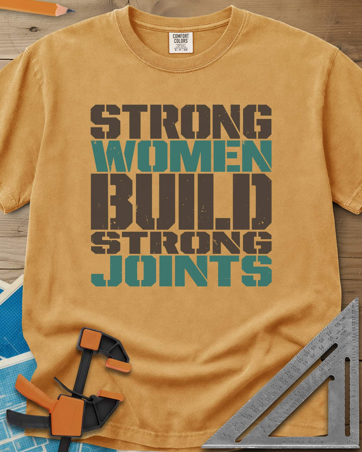 Strong Women heavyweight tee in Mustard, five lines of stacked, worn stencil capitals