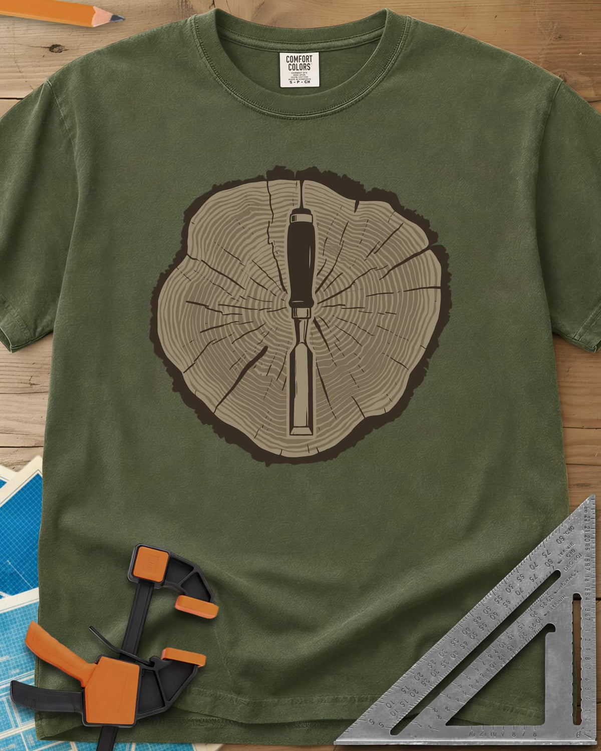 Stump & Chisel heavyweight tee in Hemp, a wood chisel set in the middle of a cracked tree-ring slice