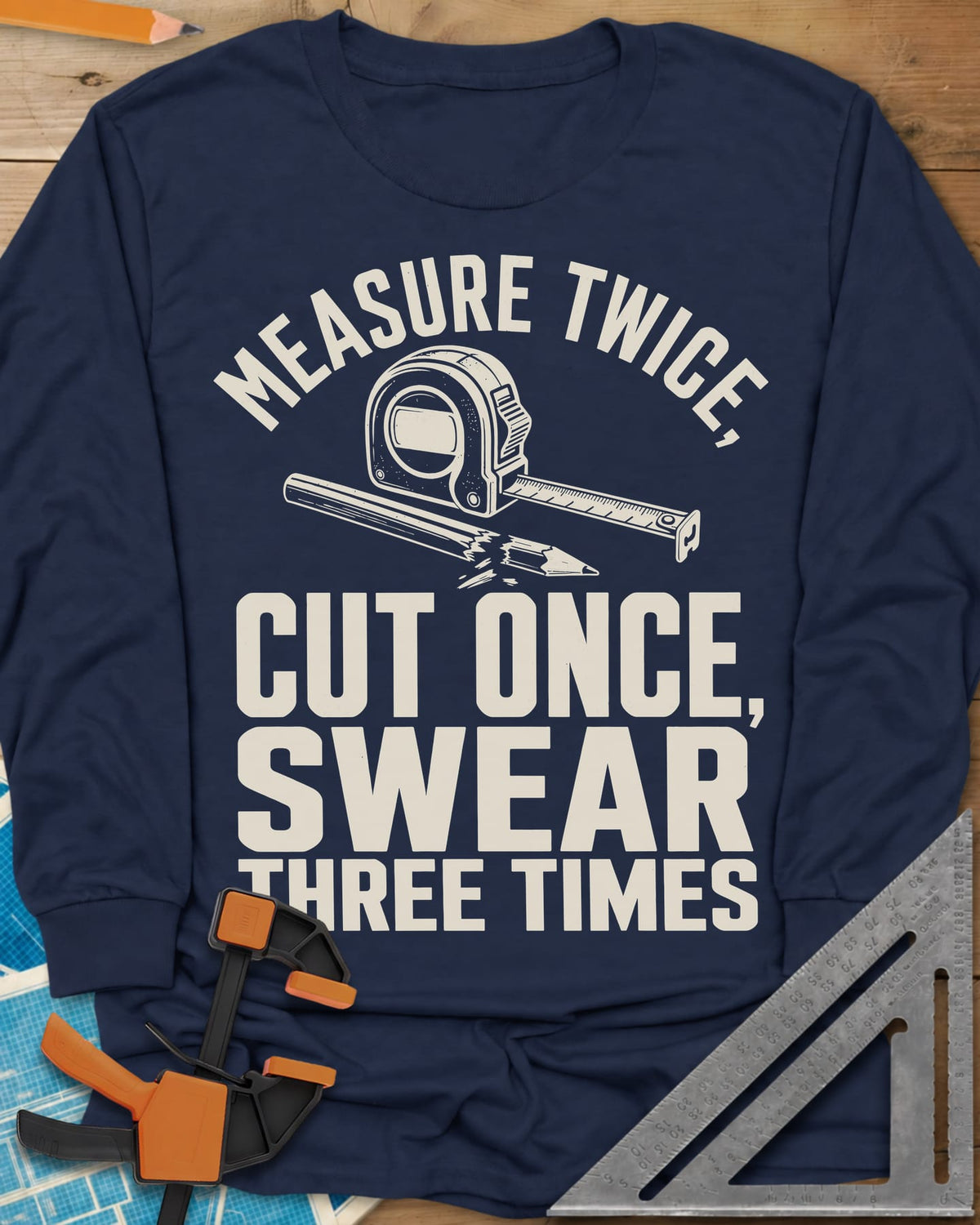 Swear Three Times long sleeve shirt in Navy, a tape measure and a pencil with a broken tip