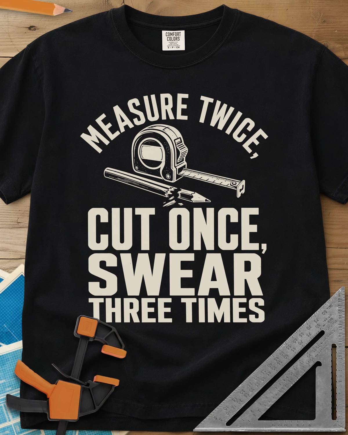 Swear Three Times heavyweight tee in Black, a tape measure and a pencil with a broken tip