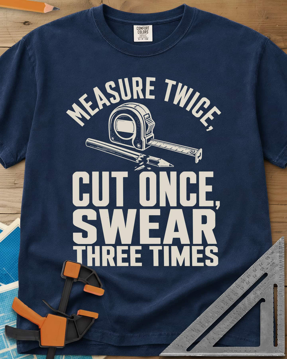 Swear Three Times heavyweight tee in Navy, a tape measure and a pencil with a broken tip
