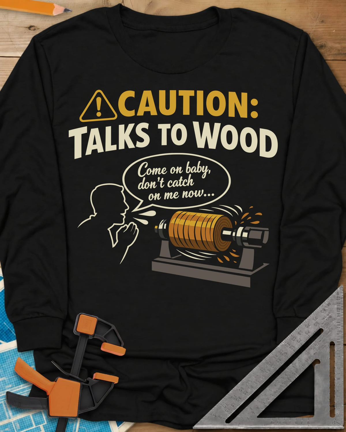 Talks to Wood long sleeve shirt in Black, a man in outline coaxing a spinning wood blank on a lathe