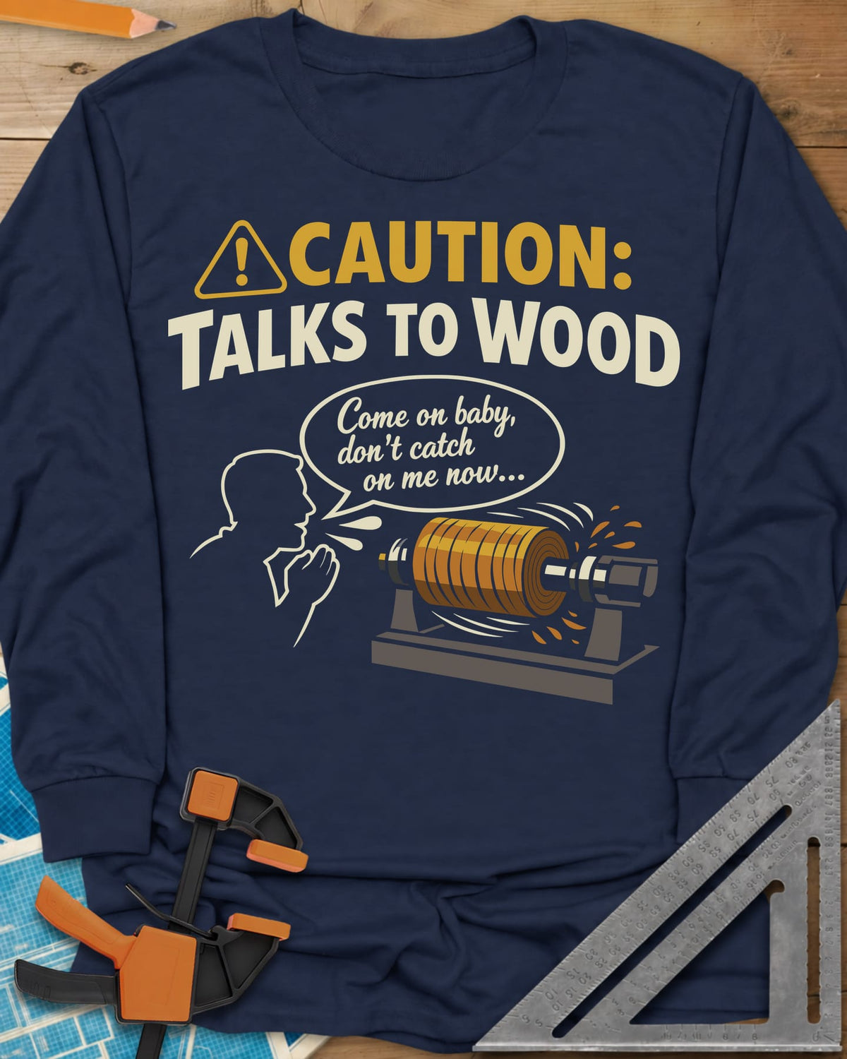 Talks to Wood long sleeve shirt in Navy, a man in outline coaxing a spinning wood blank on a lathe