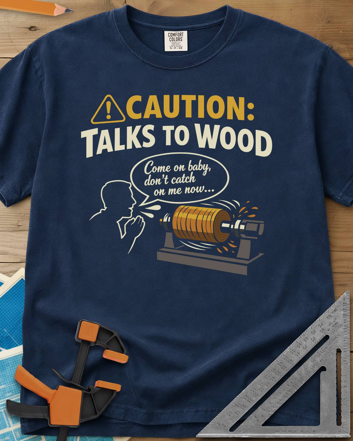 Talks to Wood heavyweight tee in Navy, a man in outline coaxing a spinning wood blank on a lathe