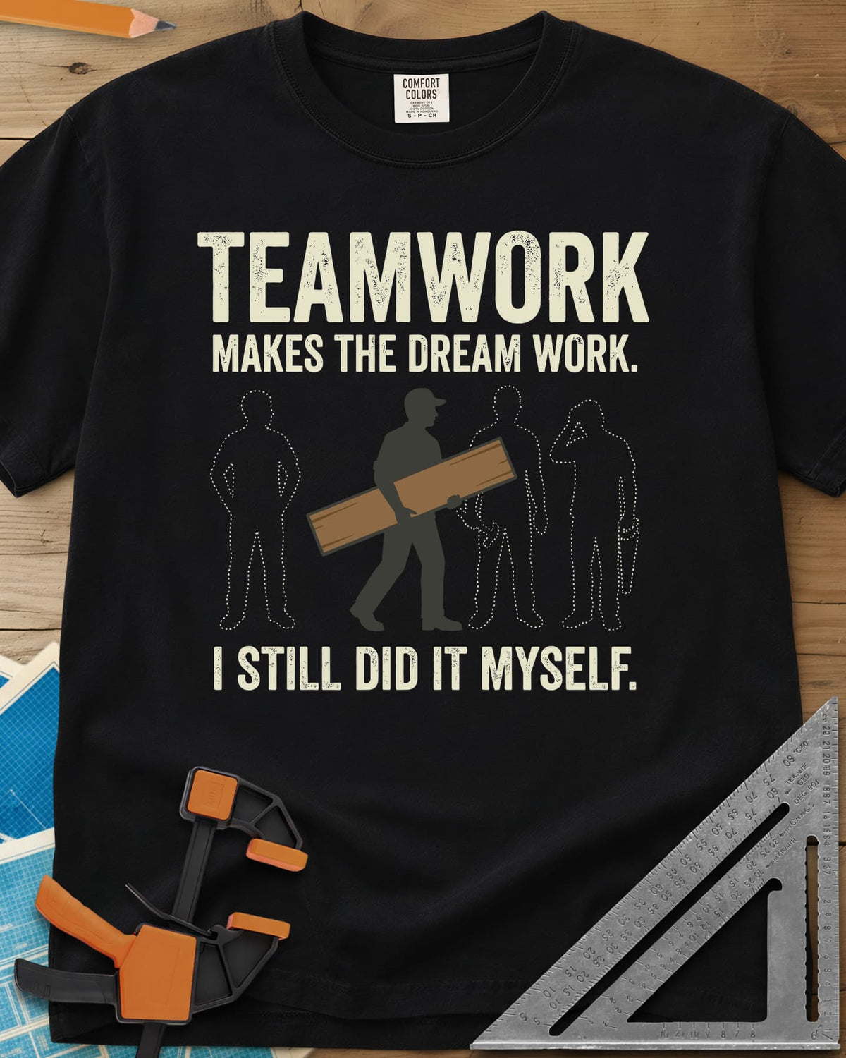 Teamwork I Did It Myself heavyweight tee in Black, a lone figure carrying a board past three dotted outlines