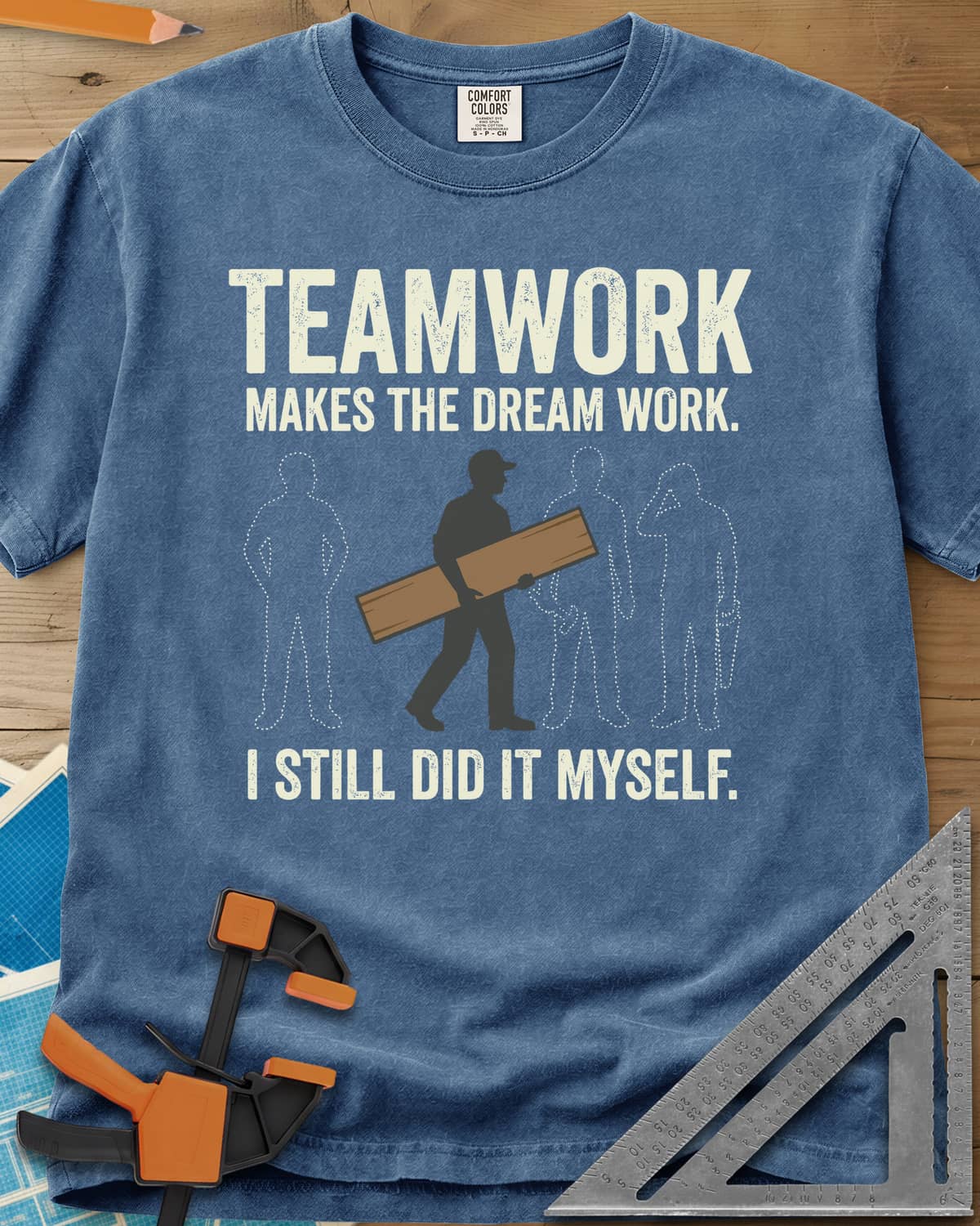 Teamwork I Did It Myself heavyweight tee in Blue Jean, a lone figure carrying a board past three dotted outlines