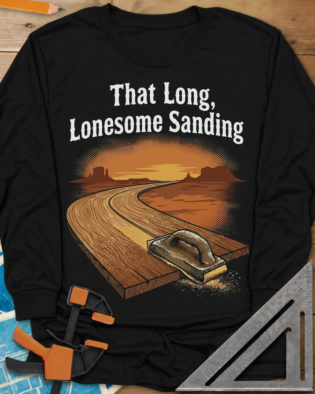 That Long, Lonesome Sanding long sleeve shirt in Black, a plank road winding through a desert sunset with a sanding block