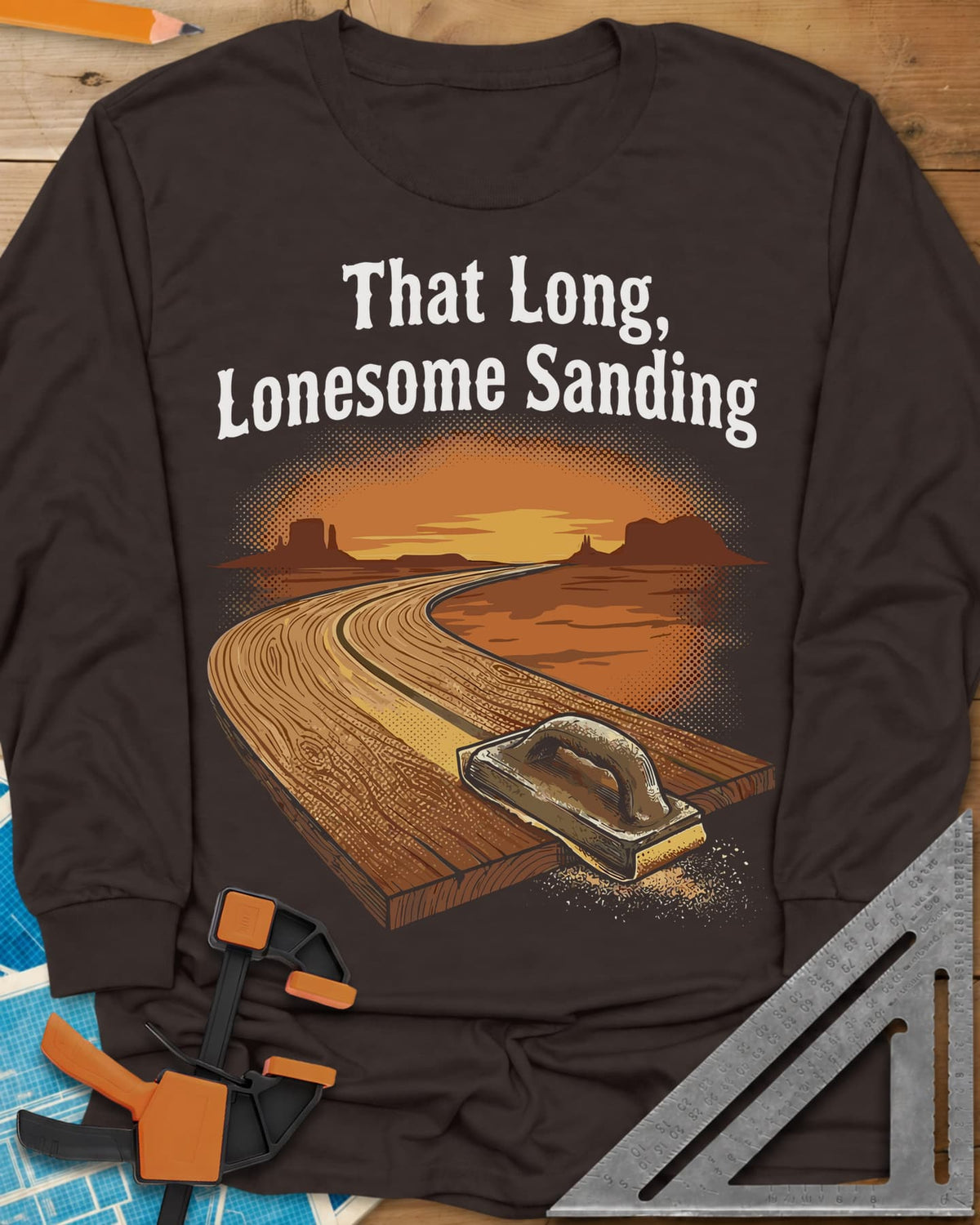 That Long, Lonesome Sanding long sleeve shirt in Dark Chocolate, a plank road winding through a desert sunset with a sanding