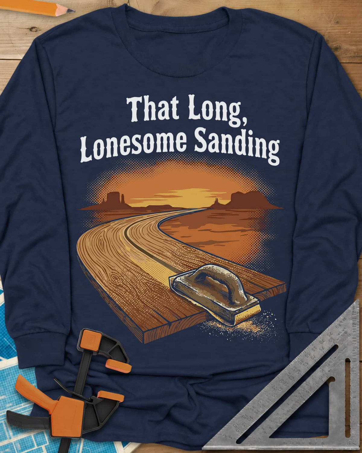 That Long, Lonesome Sanding long sleeve shirt in Navy, a plank road winding through a desert sunset with a sanding block