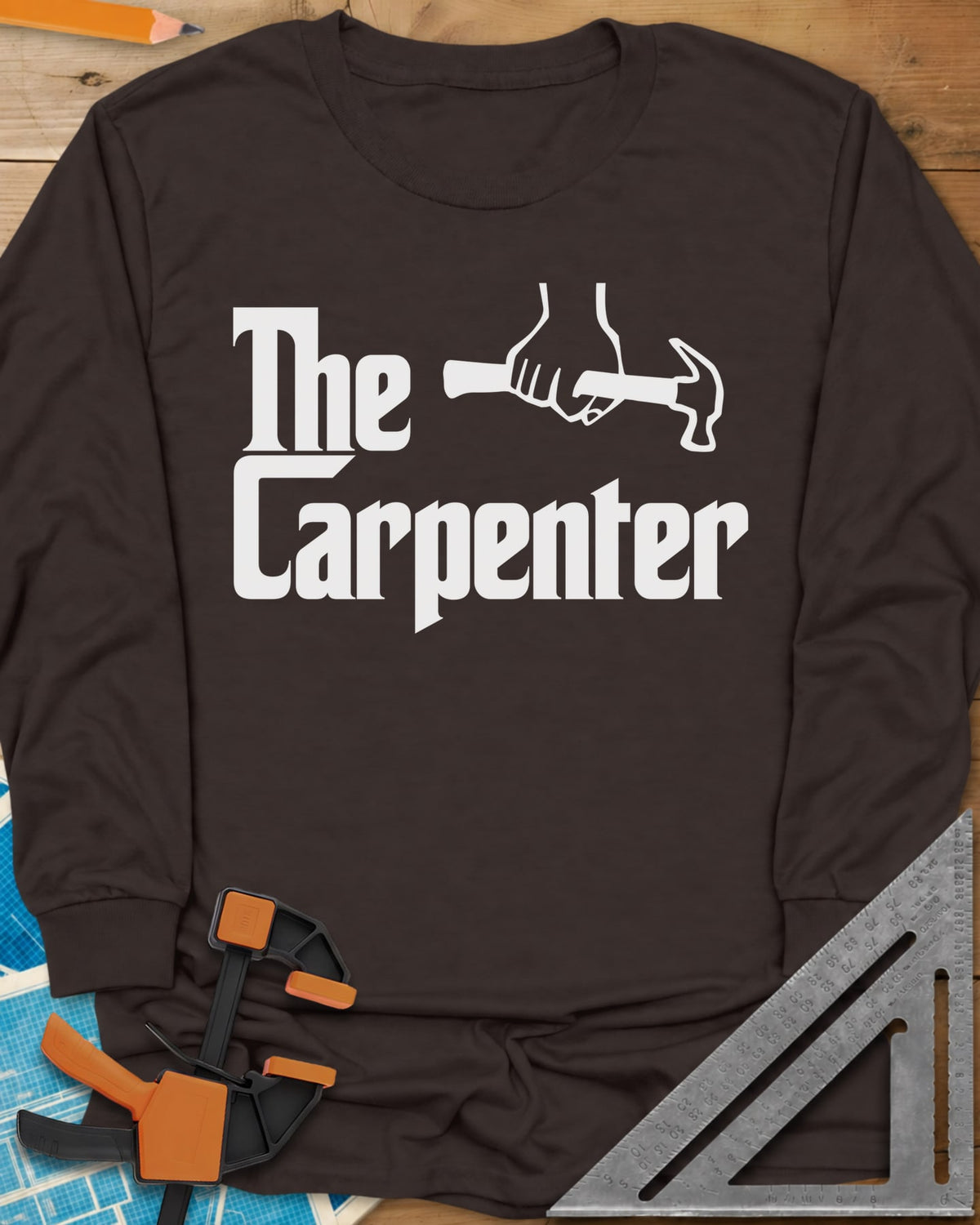 The Carpenter long sleeve shirt in Dark Chocolate, film-poster style lettering with a fist gripping a hammer
