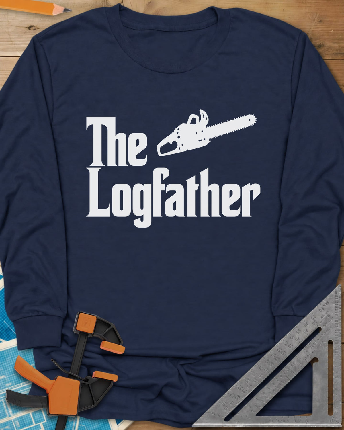 The Logfather long sleeve shirt in Navy, serif lettering with a chainsaw beside the word The